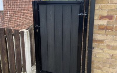 Composite side gate with wrought iron arch